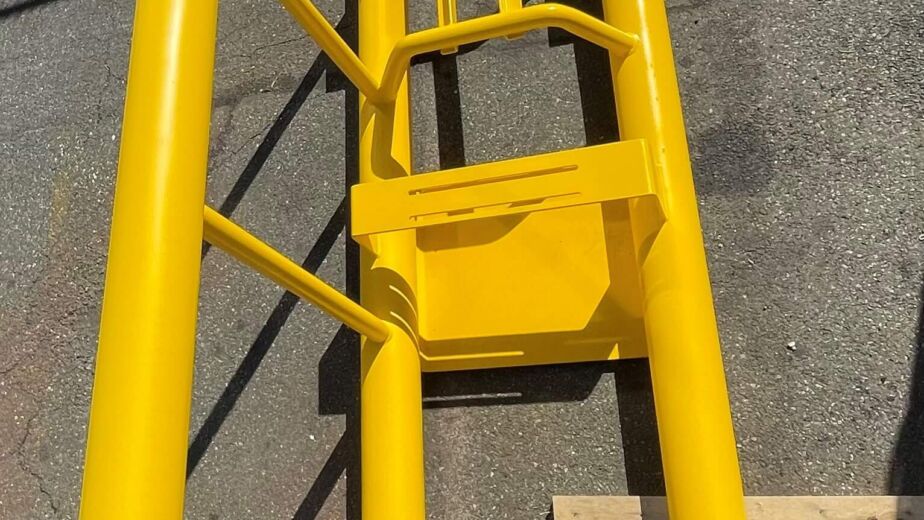 Yellow dock stanchion about to be installed